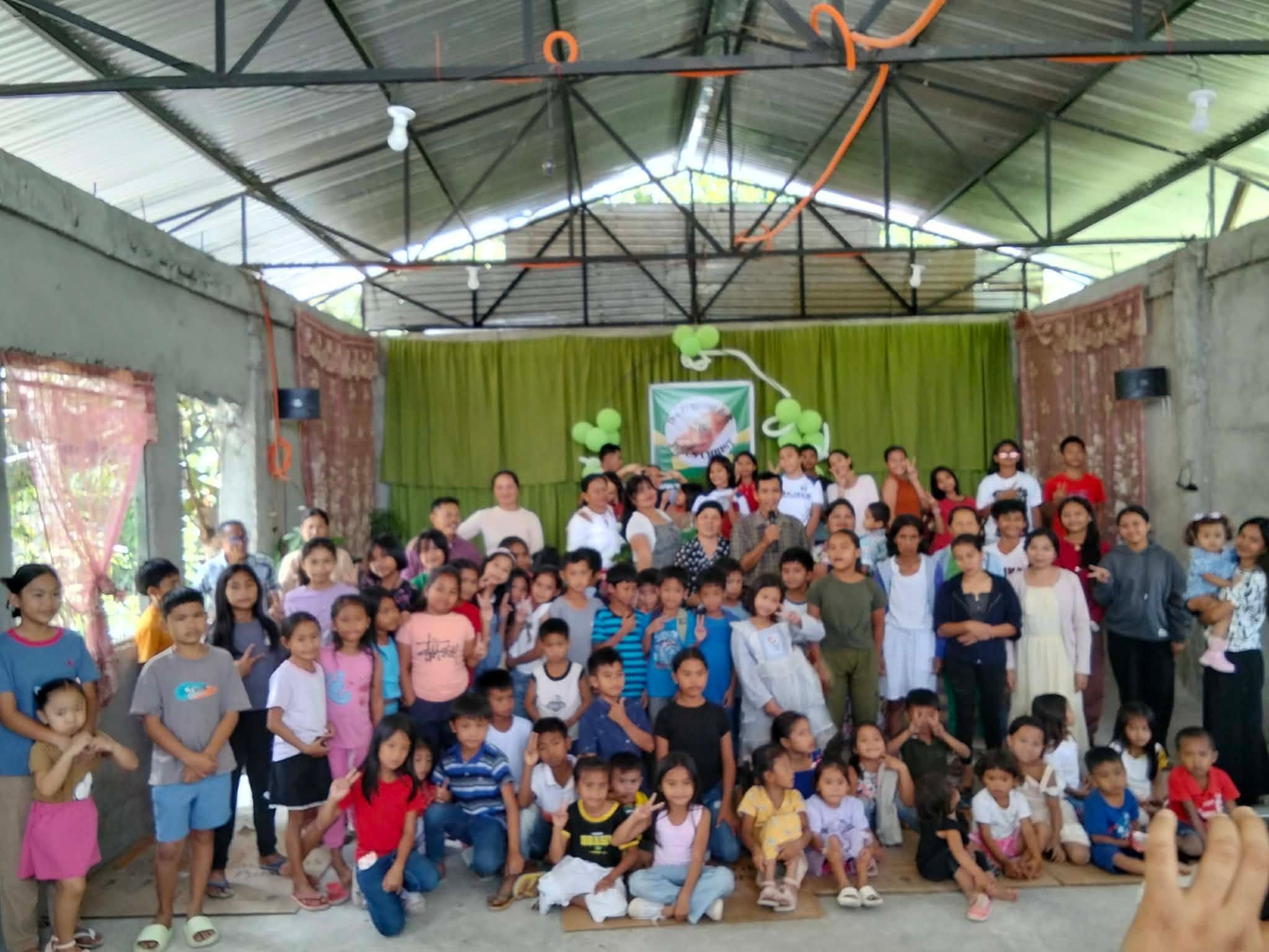 A large gathering of children and families at the ministry